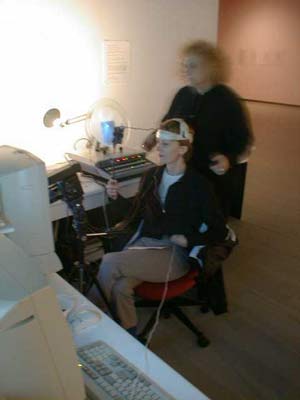 nina prepares susan plenert to be eeg artist